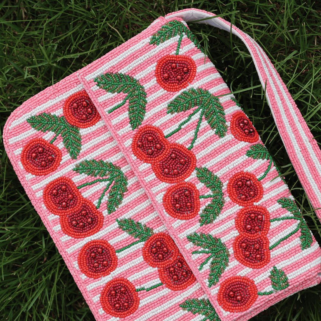 Cherry Beaded Crossbody Bag on Grass